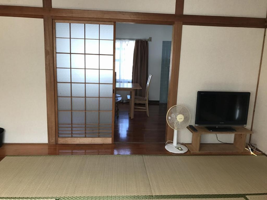 Golden Mile Apartment Amami Exterior photo